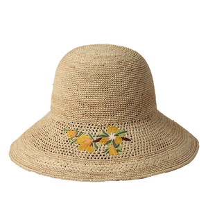 Women's raffia sun hat with elegant floral embroidery and wide brim for beach outings