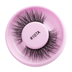 Close-up of black glue-free false eyelashes style #107A in a round pink storage case