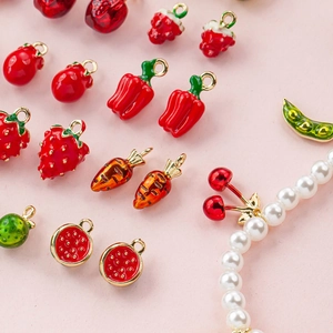 Assorted fruit and vegetable charms including strawberry and cherry pearl bracelet