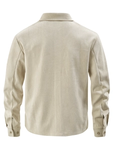 Detailed back view of a beige corduroy jacket with ribbed texture and buttoned cuffs