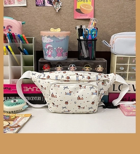 Cute white canvas dog print crossbody bag set against a aesthetic stationery desktop