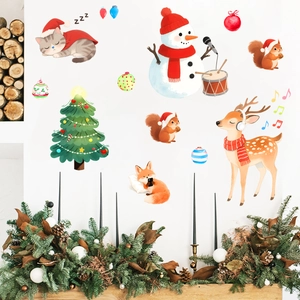 Cozy fireplace scene with festive Christmas wall stickers featuring cats and reindeer