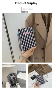 Detail of checkered crossbody phone bag with snap closure and adjustable rope strap