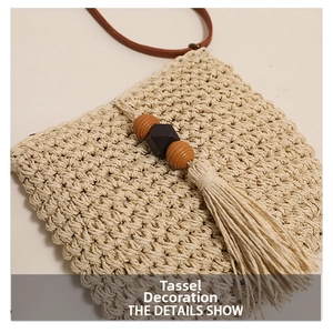 Detail of woven straw shoulder bag featuring wooden beads and long fringe tassels