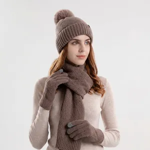 Winter 3-piece knit set including a dark coffee pom-pom beanie, scarf, and gloves