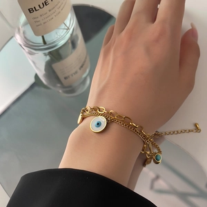 Golden double-layer Evil Eye bracelet with blue enamel charm and adjustable chain