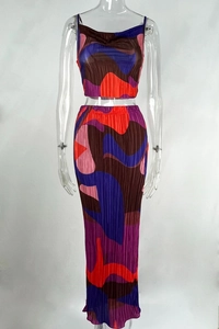 Detailed close-up of pleated geometric wave pattern on two-piece maxi set fabric