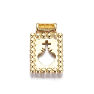 Macro shot of 18K gold plated sacred heart pendant with beaded edge and cross detail
