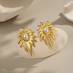 Elegant gold palm tree leaf earrings with pearl inlay for women in a luxury minimalist style