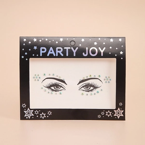 Close-up of rainbow holographic face jewels for party makeup on beige background