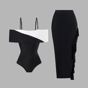 Detail of black and white contrast swimsuit with ruffled long skirt side decoration