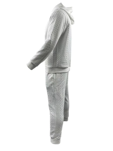 Detail showing the white embossed diamond textured fabric of this men's hooded tracksuit
