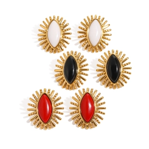 Retro stainless steel sunburst earrings set in gold with white, black, and red stones