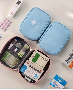Macro view of first aid bag interior with mesh pockets and elastic bandage straps
