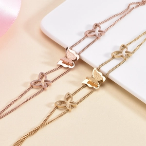 Doppelreihiges Schmetterling-Armband in Roségold und Gold mit mattierter Oberfläche