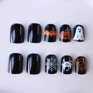 Halloween press-on nails with spider web, ghost and bat designs on black square nails