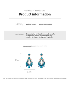 Macro detail of teardrop tassel earrings with blue rhinestones and 7.7cm size scale