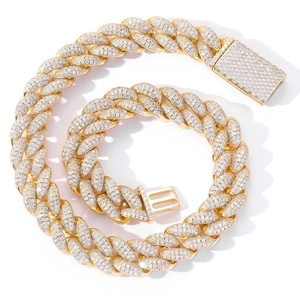 Luxury 20mm gold Cuban link chain with micro-paved zircons on a white background