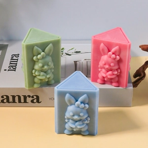 Detailed relief of cute Easter bunny holding a carrot on silicone candle molds