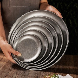 Nesting set of vintage round 304 stainless steel industrial dinner plates in dark grey
