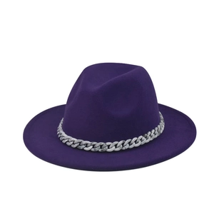 Close-up of a purple wool fedora hat featuring a marble textured chunky chain accessory