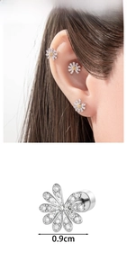 Detailed view of daisy stud earring with white zircons and orange center stone, size 0.9cm