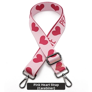 Detail of pink woven bag strap with red hearts and gunmetal swivel lobster clasp