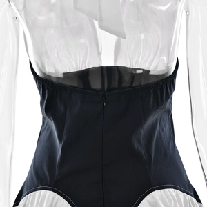Detail of the back hidden zipper and white halter neck design on a sexy bodycon dress