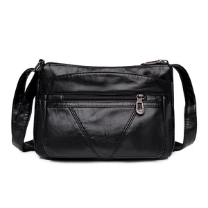 Sac bandoulière classique en cuir noir pour femme avec plusieurs poches zippées et souple