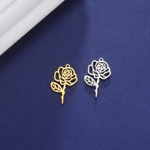 Detail of hollow rose pendants in gold and silver finish for DIY jewelry making