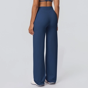 Detailed back view of high waisted wide leg yoga pants in navy blue stretch knit fabric