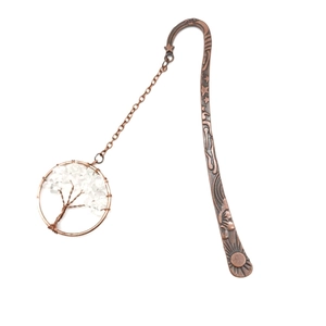 Detail of vintage bronze metal bookmark with a handmade crystal tree of life pendant charm