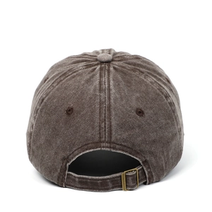 Close-up of vintage brown cotton baseball cap back with adjustable brass buckle