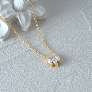 Macro shot of 925 silver water drop necklace with three marquise-cut marquise stones