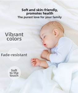 Close-up of soft white cotton bath towel texture showing thick absorbent fibers for baby care