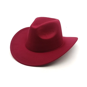 Detail view of the wide brim wine red wool felt western cowboy hat with curved edge