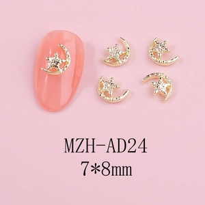 Detailed close-up of gold 7x8mm hollow star and moon alloy charms on pink nails