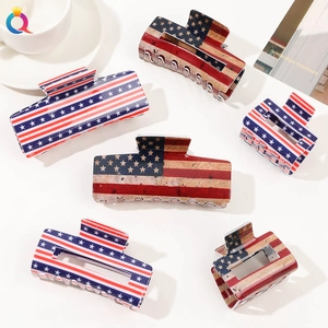 Flat lay of six American flag hair claws in vibrant and vintage styles on white background