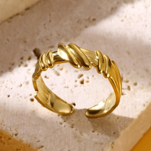 Adjustable 18K gold plated stainless steel wavy rope ring on minimalist stone base