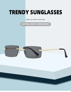 Close-up of rimless square sunglasses with gold metal temples on a geometric platform