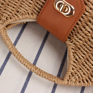 Chic paper rope woven crossbody bag with brown leather clasp and gold twist lock detail