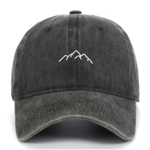Macro shot of mountain embroidery on washed distressed dark gray baseball cap