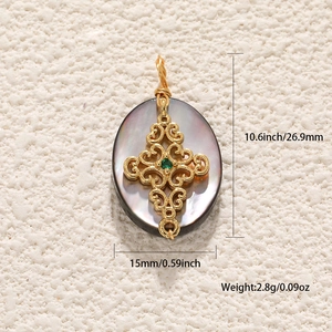 Macro shot of oval mother-of-pearl pendant with gold cross and size specifications
