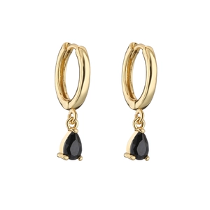Detail of gold huggie hoop earrings featuring faceted black pear-cut crystal teardrops