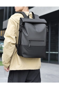 Detail of waterproof roll-top backpack with side buckles and padded shoulder straps