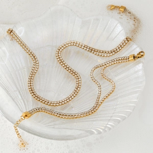Double-row cubic zirconia tennis necklace in gold-plated stainless steel with shell tray