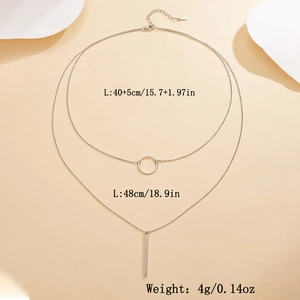 Detailed specs of double-layer silver geometric necklace with circle and bar pendants