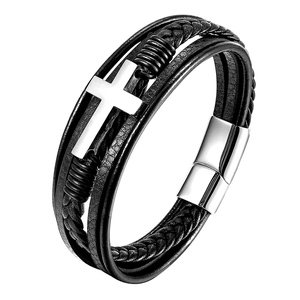 Detail of multi-layer black braided leather bracelet with silver metal cross and magnetic clasp