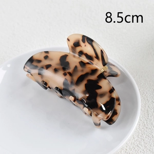 Detailed view of tortoise shell pattern hair claw clip measuring 8.5cm in length