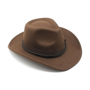 Detail of western brown felt hat featuring a black leather woven decorative band